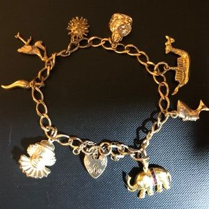 9 ct gold charm bracelet with 8 charms